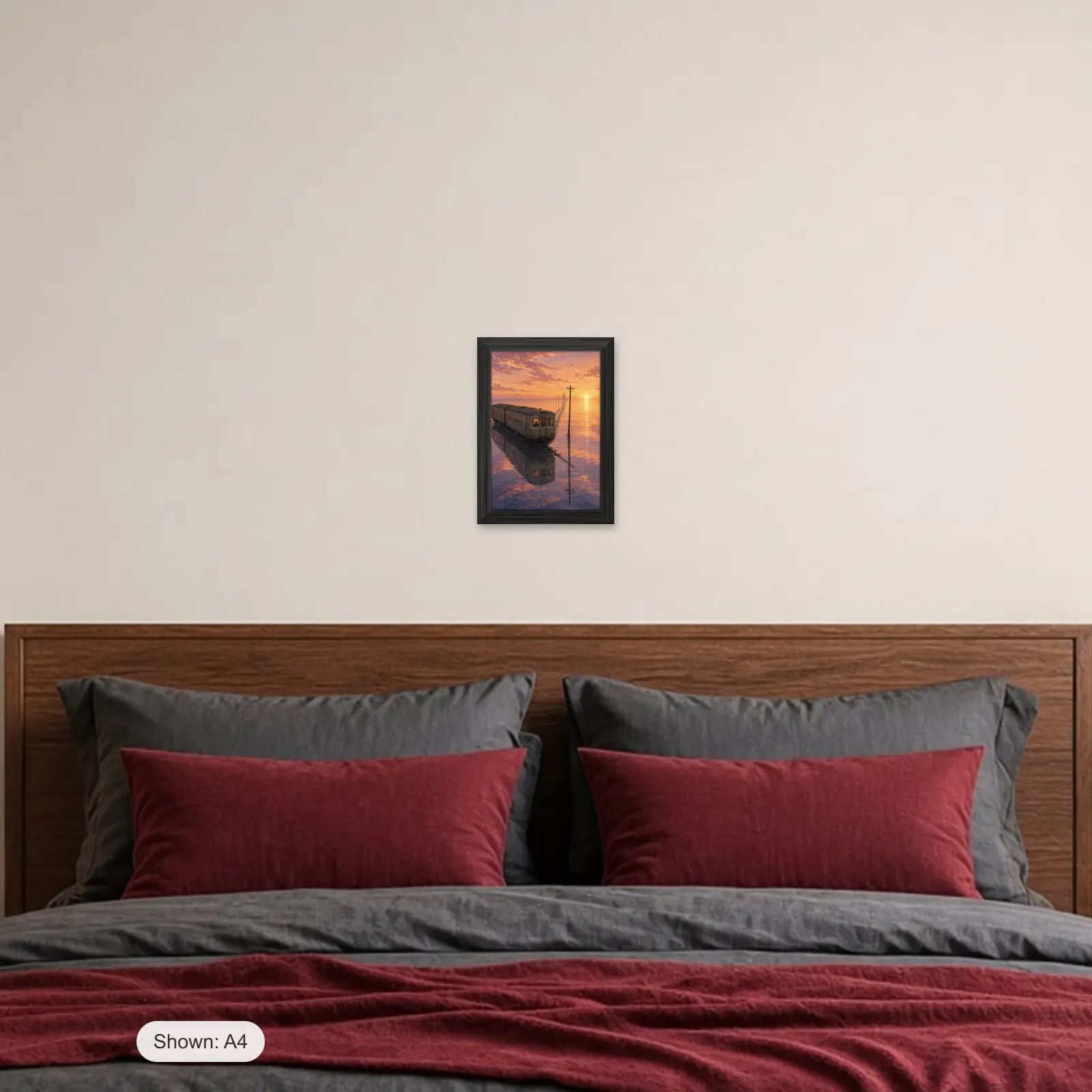 Last Train Home Art Print above a bed with crimson pillows