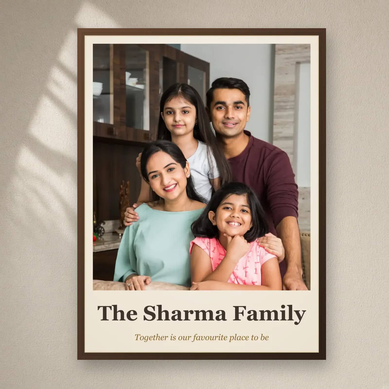 Family Photo Frame with Family Name on a plain wall