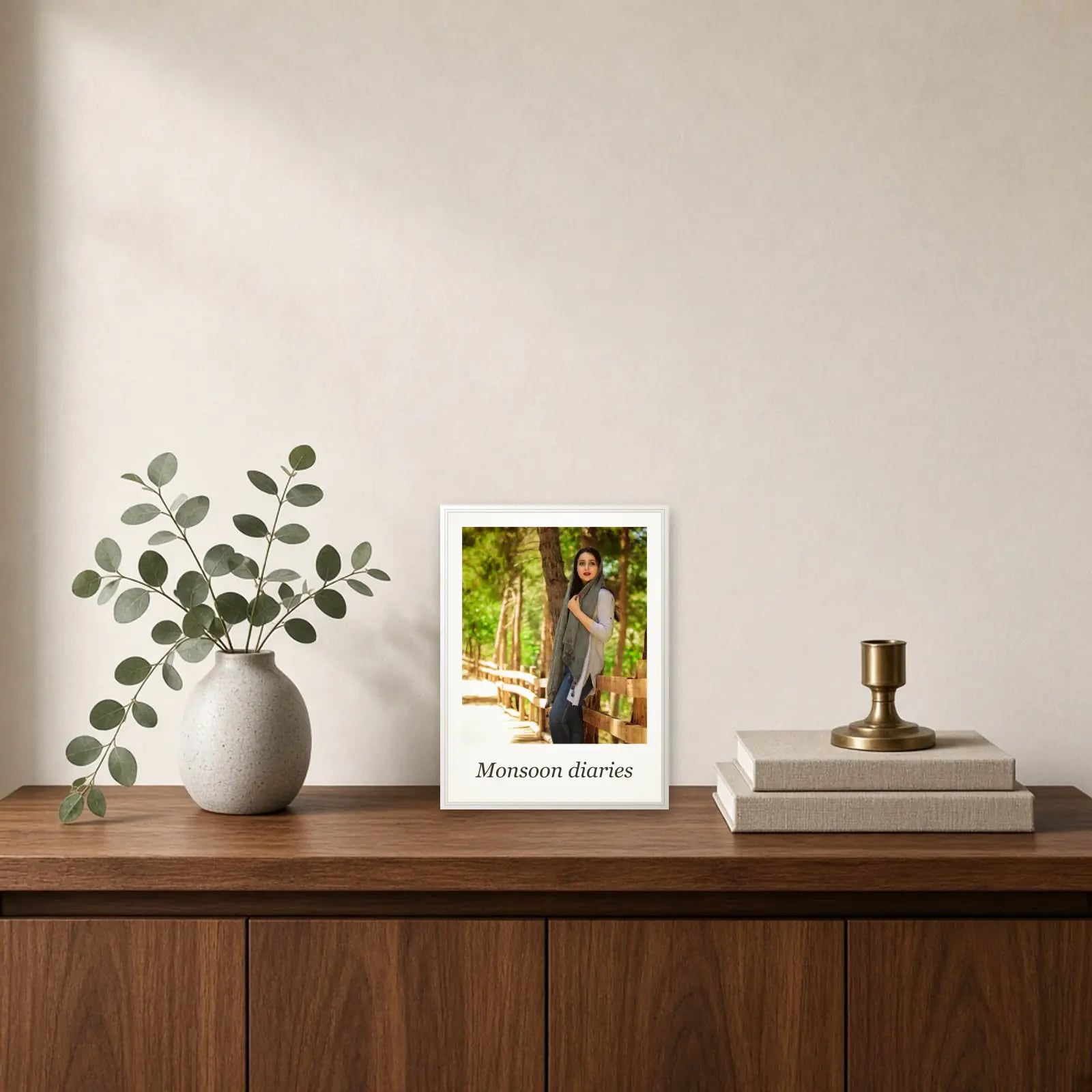 Polaroid Photo Frame with Caption standing on a sideboard