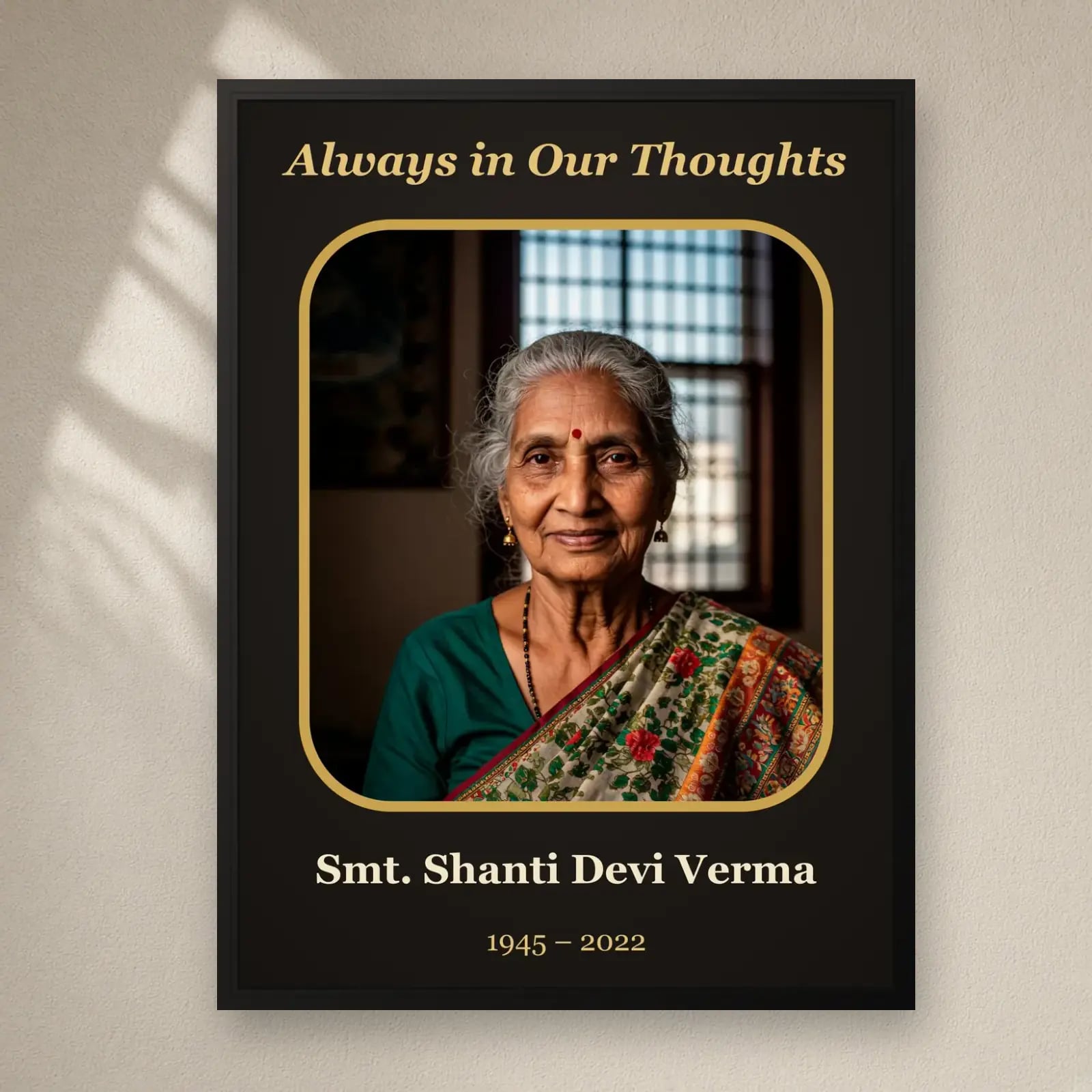 Always in Our Thoughts Memorial Frame on a plain wall