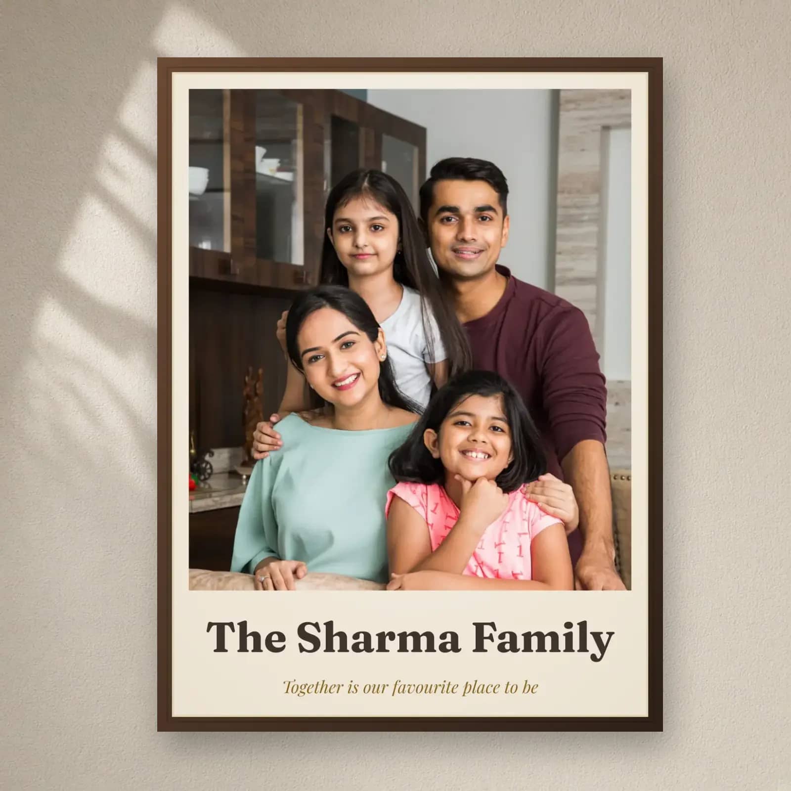 Family Photo Frame with Family Name on a plain wall