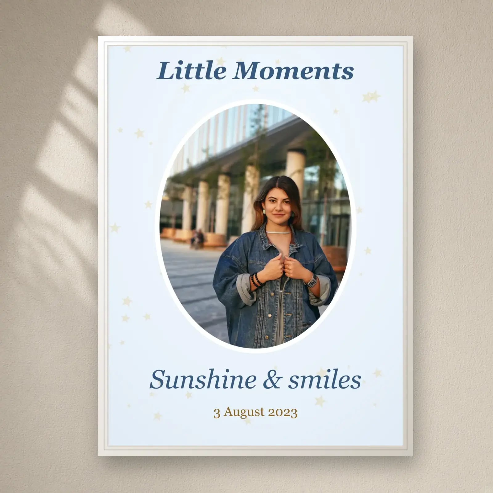 Little Moments Oval Photo Frame on a plain wall