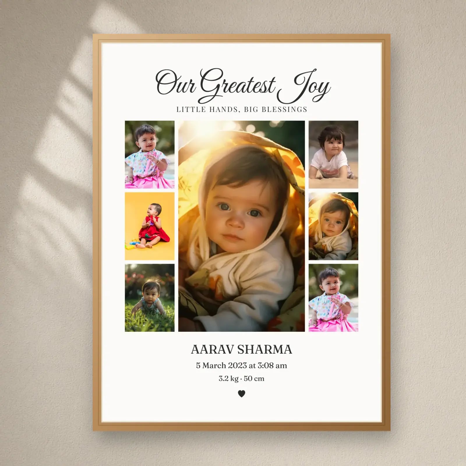 Our Greatest Joy Baby Frame — 7 Photos on a plain wall