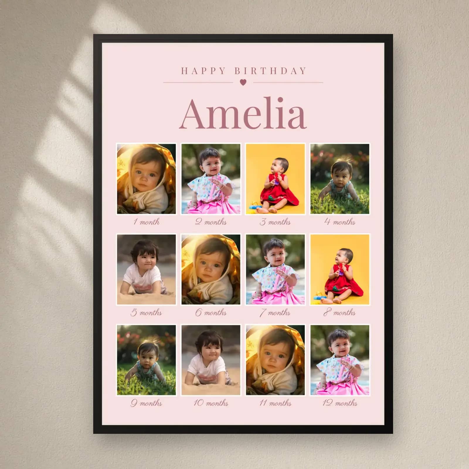 Pink First Birthday 12 Months Frame on a plain wall